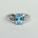 9 carat white gold blue topaz and diamond ring, 2.8 grams. Size K, 8 mm top. UK Postage £12.