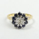 18 carat gold sapphire and diamond ring, London 1977, 3.9 grams. Size M, 12 mm top. UK Postage £12.