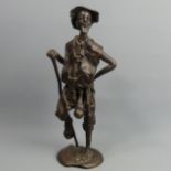 A well modelled mid-20th century African bronze figure of a peasant. 32 cm high. UK postage £16.