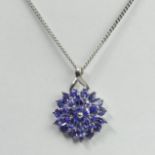 9 carat white gold tanzanite pendant and chain, 4.6 grams. 16.5 mm wide. Chain 46 cm. UK Postage £