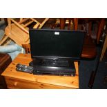 A SMALL 21" FLATSCREEN TV - REMOTE WITH VCR/DVD PLAYER (2)