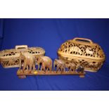 A CARVED WOODEN ELEPHANT TRAIN AND TWO CARVED WOODEN LIDDED BASKETS