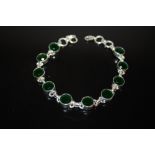 A STERLING SILVER AND GREEN STONE BRACELET