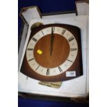 AN OAK WALL HANGING WALL CLOCK WITH PENDULUM AND WEIGHTS