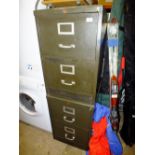 A PAIR OF TWO DRAWER METAL FILING CABINETS