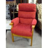 A MODERN RED UPHOLSTERED ARMCHAIR