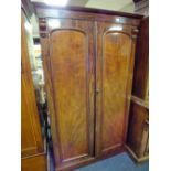 A 19TH CENTURY TWIN DOOR WARDROBE OF SMALL PROPORTIONS, the twin doors opening ti a hanging rail and