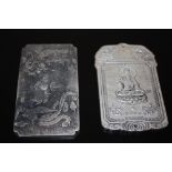 TWO ORIENTAL STYLE WHITE METAL PLAQUES/ TALISMANS