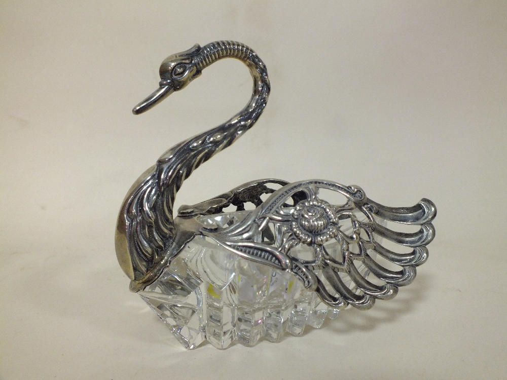 A CUT GLASS AND 925 SILVER SWAN SHAPED TRINKET BOX WITH HINGED WINGS