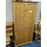 A HONEY PINE DOUBLE WARDROBE AND A BEDSIDE CHEST (2)