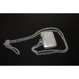 AN ANTIQUE SILVER VESTA CASE ON 29" SILVER CHAIN