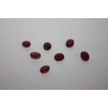 SEVEN ASSORTED RUBY TYPE STONES