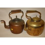 A VINTAGE BRASS KETTLE TOGETHER WITH A COPPER EXAMPLE