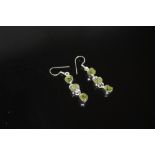 A PAIR OF STERLING SILVER AND PERIDOT EARRINGS