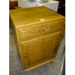 AN ERCOL WINDSOR SIDE CABINET H-69 W-46.5 CM