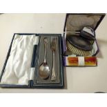 A CASED HALLMARKED SILVER HAND BRUSH TOGETHER WITH A HALLMARKED SILVER SPOON AND FORK SET