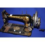 A VINTAGE SINGER SEWING MACHINE