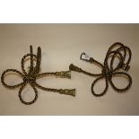 A PAIR OF VINTAGE BRASS CURTAIN TIES