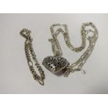 A PIERCED SILVER HEART LOCKET ON CHAIN TOGETHER WITH A BREAK, APPROX TOTAL WEIGHT 26.9G