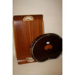 AN INLAID MAHOGANY TWIN HANDLED BEAN SHAPED SERVING TRAY TOGETHER WITH A FOLDING TABLE TRAY