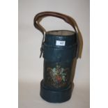 AN ANTIQUE LEATHER CORDITE SHELL CARRIER AMMUNITION CASE DECORATED WITH A COAT OF ARMS