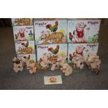 A COLLECTION OF BOXED PIGGIN FIGURES