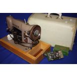 A CASED SINGER 198651 ELECTRIC SEWING MACHINE