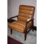 A RETRO STYLE TAN LEATHER ARMCHAIR