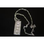 A HALLMARKED SILVER INGOT ON CHAIN