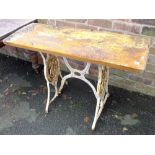 A SMALL TABLE WITH CAST METAL LEGS A/F
