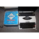 AN IMPERIAL 285 PORTABLE TYPEWRITER TOGETHER WITH A GAS CAMPING STOVE