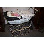 A SILVERCROSS DOLLS PRAM AND CONTENTS