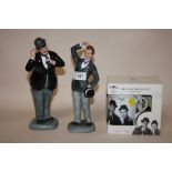A PAIR OF ROYAL DOULTON STAND LAUREL AND OLIVER HARDY FIGURES HN2774 AND HN 2775 TOGETHER WITH A