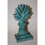 A VINTAGE DOORSTOP IN THE SHAPE OF A SHEAF OF CORN