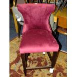 A MODERN PURPLE UPHOLSTERED BAR STOOL