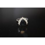 A STERLING SILVER AND MODERN BLACK DIAMOND STYLE DRESS RING
