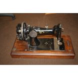 A CASED SEWING MACHINE