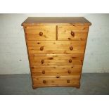 A SOLID PINE CHEST OF DRAWS, TWO OVER FOUR