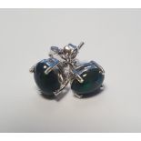 A PAIR OF CABOCHON BLACK ETHIOPIAN OPAL SILVER STUDS