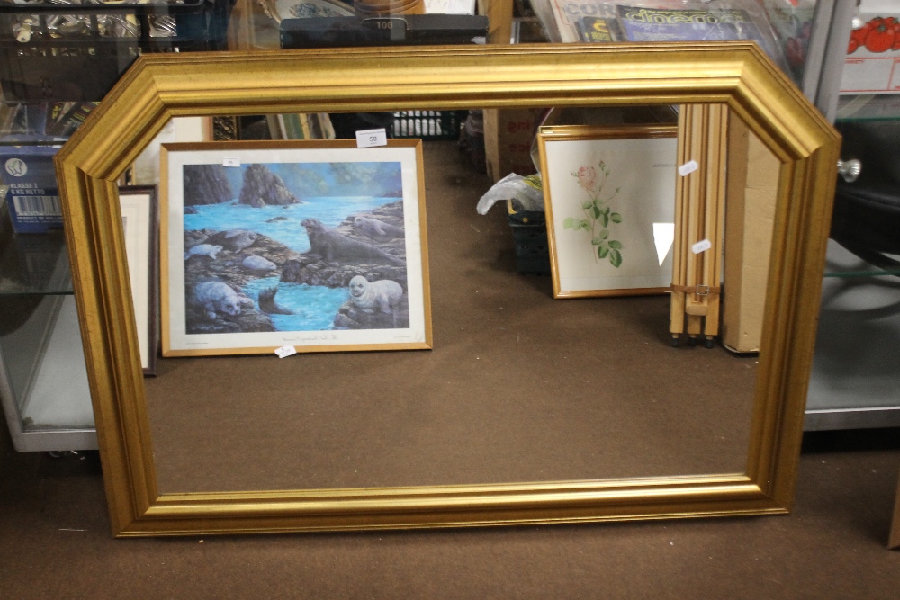 A FRAMED MIRROR APPROX. 107 X 77 CM