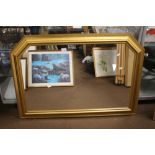 A FRAMED MIRROR APPROX. 107 X 77 CM