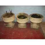 THREE RECONSTITUTED STONE GARDEN PLANTERS