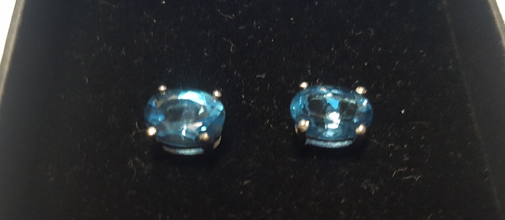 A PAIR OF LONDON BLUE TOPAZ STUDS, BOXED