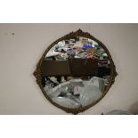 A FRAMED AND GLAZED CIRCULAR MIRROR APPROX. 72 X 72 CM