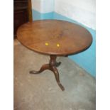 A GEOGIAN OAK ROUND FLIP TOP TABLE