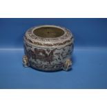 AN ORIENTAL FOOTED BOWL WITH DRAGON DESIGN