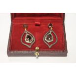 A PAIR OF DROP EARRINGS STAMPED 585 AND 925 SET WITH GARNETS AND DIAMONDS, BOXED