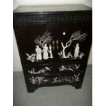 AN EMBOSSED JAPANESE THEMED STYLED DRINKS CABINET TALL BOY / CUPBOARD / CHEST WITH TWO DRAWS