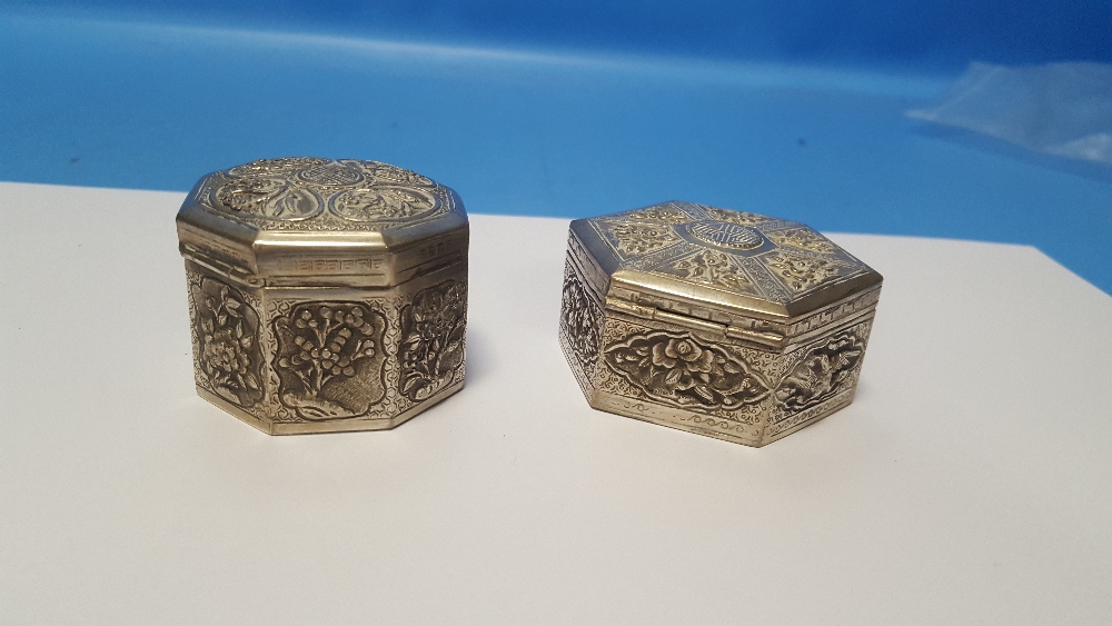 TWO CHINESE EXPORT WHITE METAL SNUFF/TRINKET BOXES, BOTH WITH TYPICAL EMBOSSED DECORATION, THE