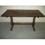 AN OAK FIXED DINING TABLE